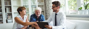 Couple discussing retirement with a financial planner.