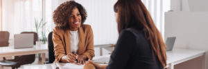 Woman speaking with a member / customer