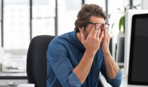 Man stressed from travel scams.